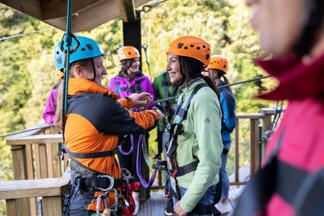 lady being fitted out at Rotorua canopy tours