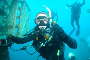 A Diver on the HMS Canterbury, Deep Water Cove in the Bay of islands