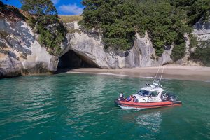 Cathedral Cove Scenic Boat Tours cruising past the natural arch at Cathedral Cove