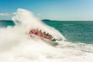 jet boating in the Bay of Islands doing a 360 spin, water overspaying water
