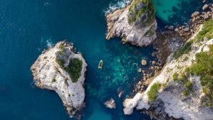Coastal cruise viewing Cathedral Cove cliffs and arch near Hahei, Coromandel