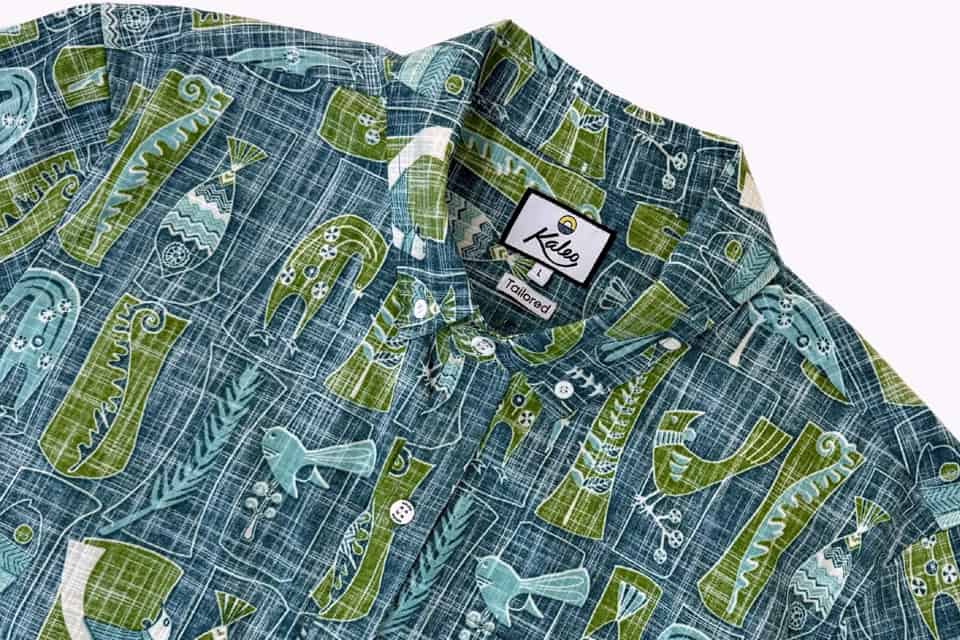 Blue-green patterned button-down shirt with nautical motifs and a Kaleo Tailored label at the collar.