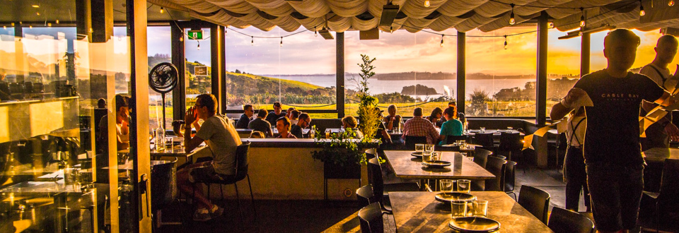 people enjoying lunch at one of Waiheke Islands vineyards