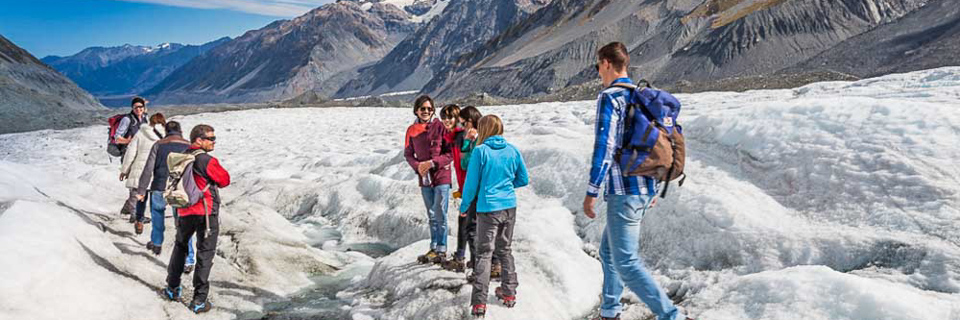 tourists walking on the Franz Josef Glacier on a Guided Heli-Hike