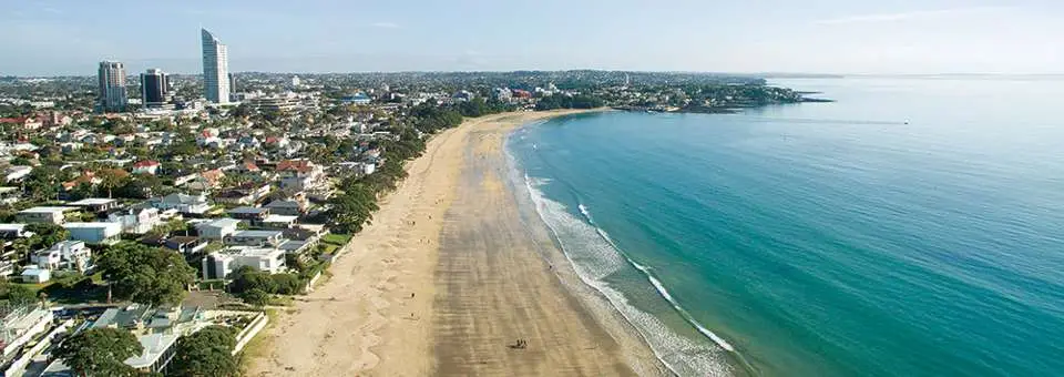 drone view looking up Takapuna beach