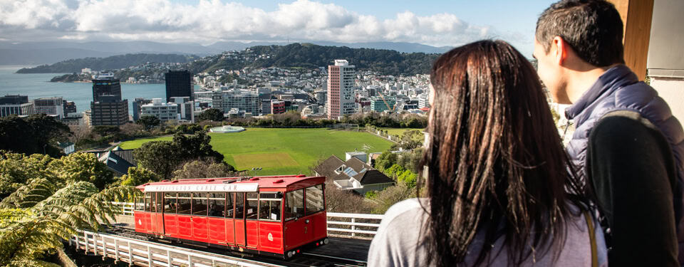 young couple watching cable Car in Wellington