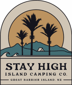 Logo for Stay High Island Camping Co. featuring a circular sunset scene with tall palm trees, waves, and mountains, and a small tent; includes the text 'STAY HIGH ISLAND CAMPING CO. GREAT BARRIER ISLAND, NZ'